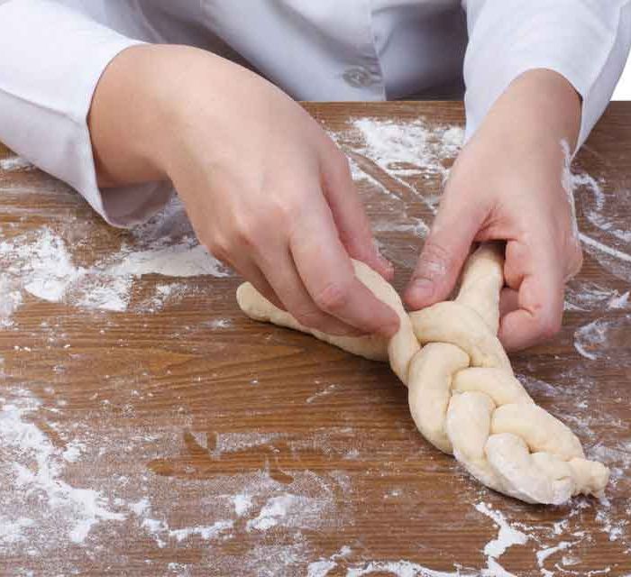 Challah bread being braided